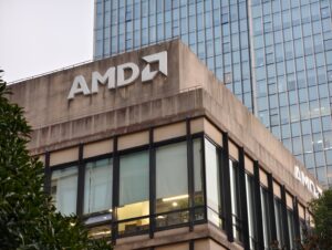 Logotipo da AMD em fundo tecnológico representando a empresa de semicondutores.
